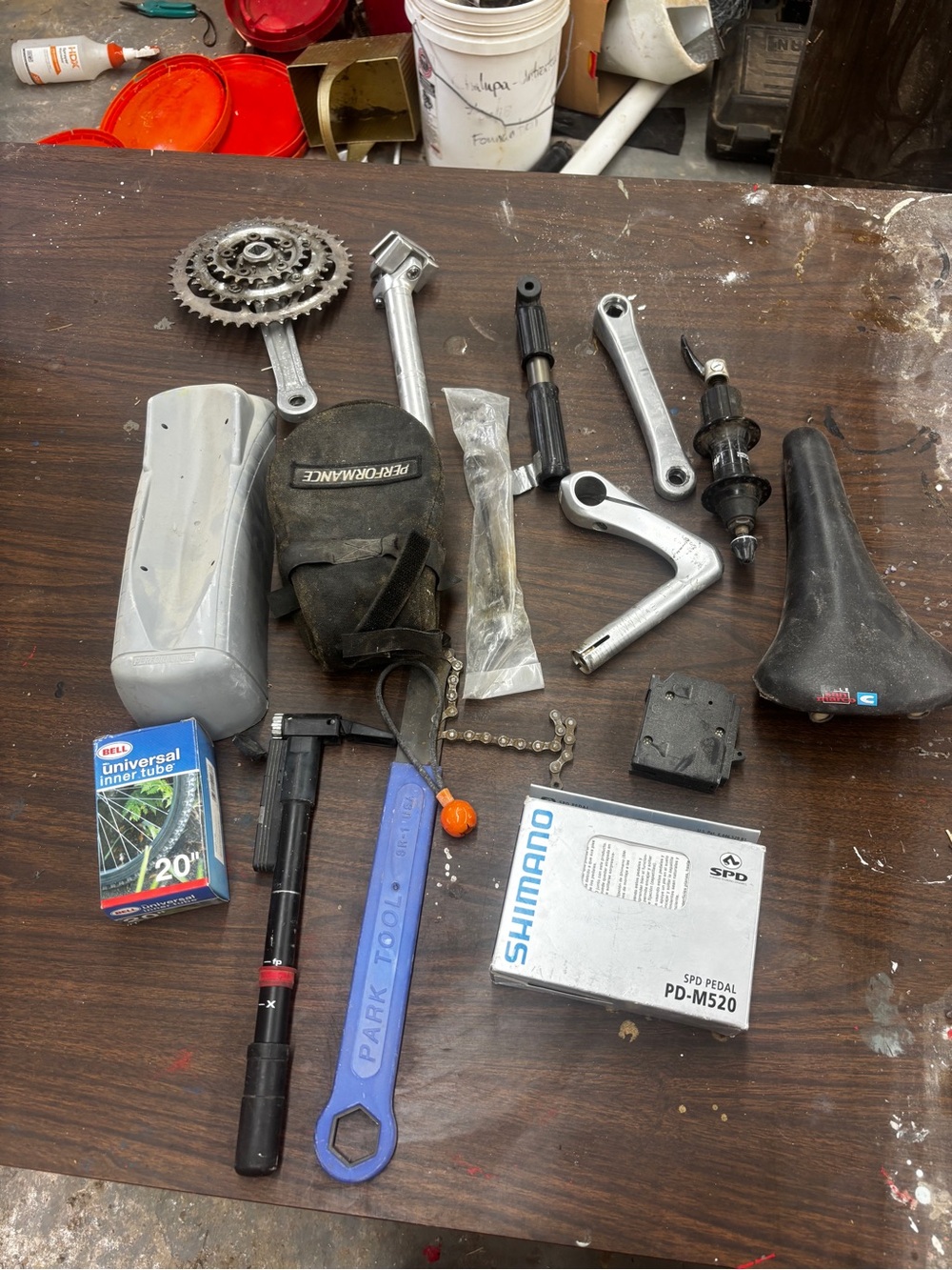 Miscellaneous biking materials Belongings on workshop table